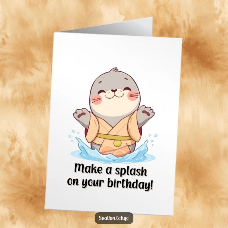 Funny Free Printable Birthday Card: A playful seal lion in a cheerful kimono joyfully splashes water with its paws.