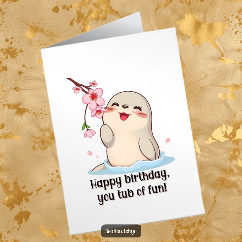 Free Printable Birthday Card: Happy rotund sea lion playfully batting at a cherry blossom